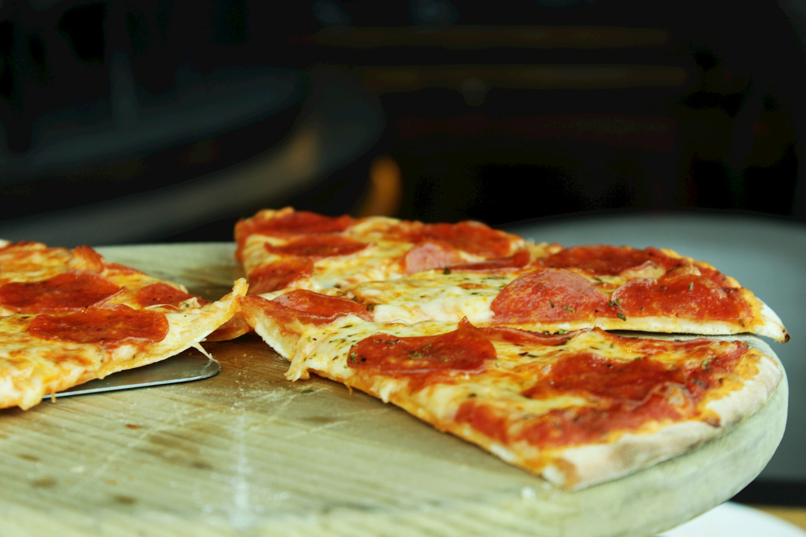 pizza on brown wooden table