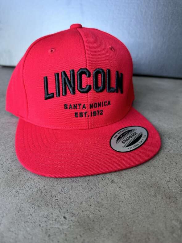 Red Flat Brimmed Hat with Lincoln Wordmark